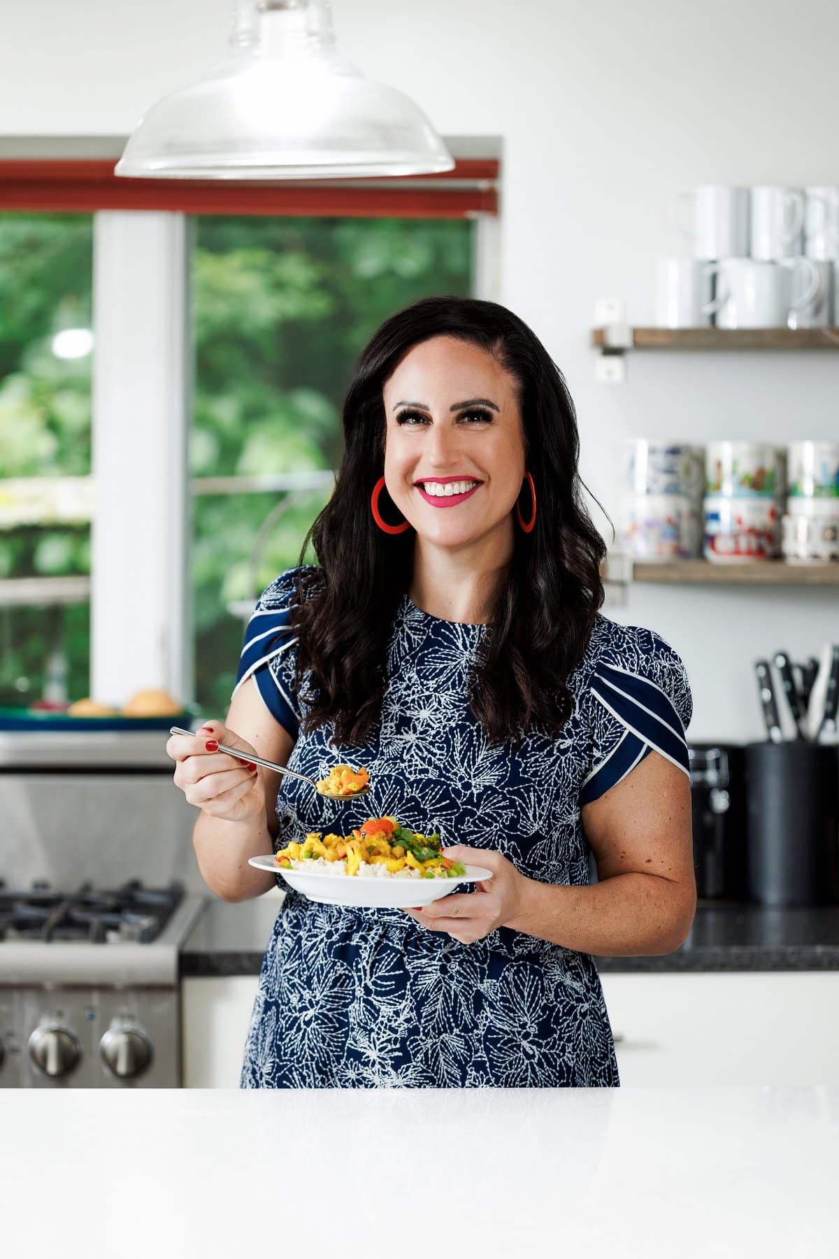 Liz eating slow cooker vegetable curry.
