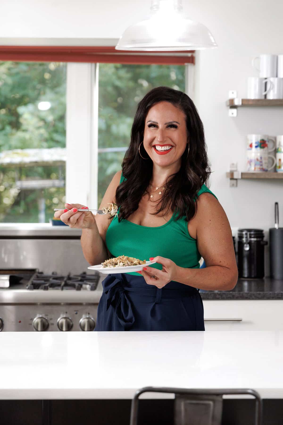 Liz eating chicken and mushroom casserole.