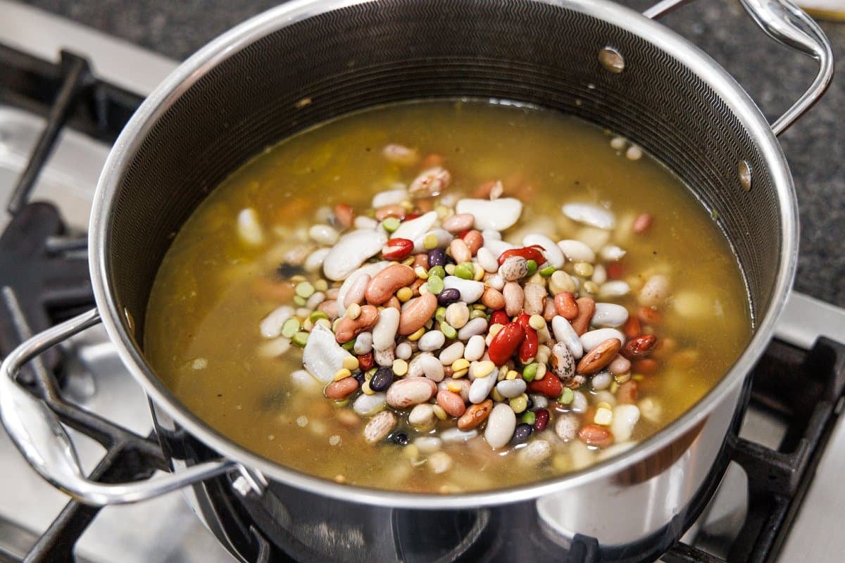 Soaked 15 bean soup mix added to soup pot.