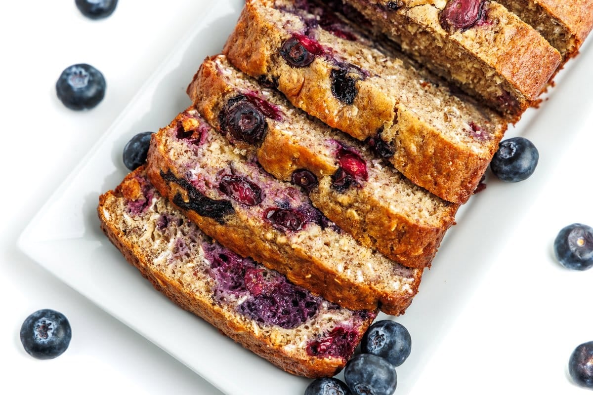 Blueberry yogurt bread on a white plate.