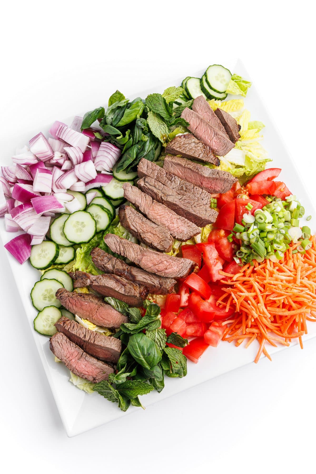 Vietnamese beef salad on a large white platter.