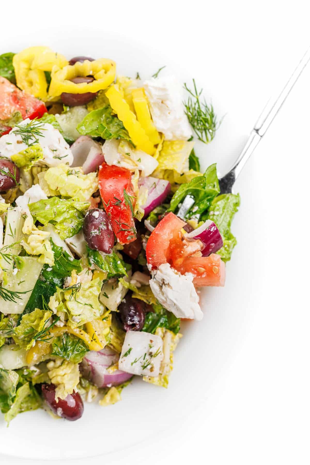 Forkful of traditional Greek salad.