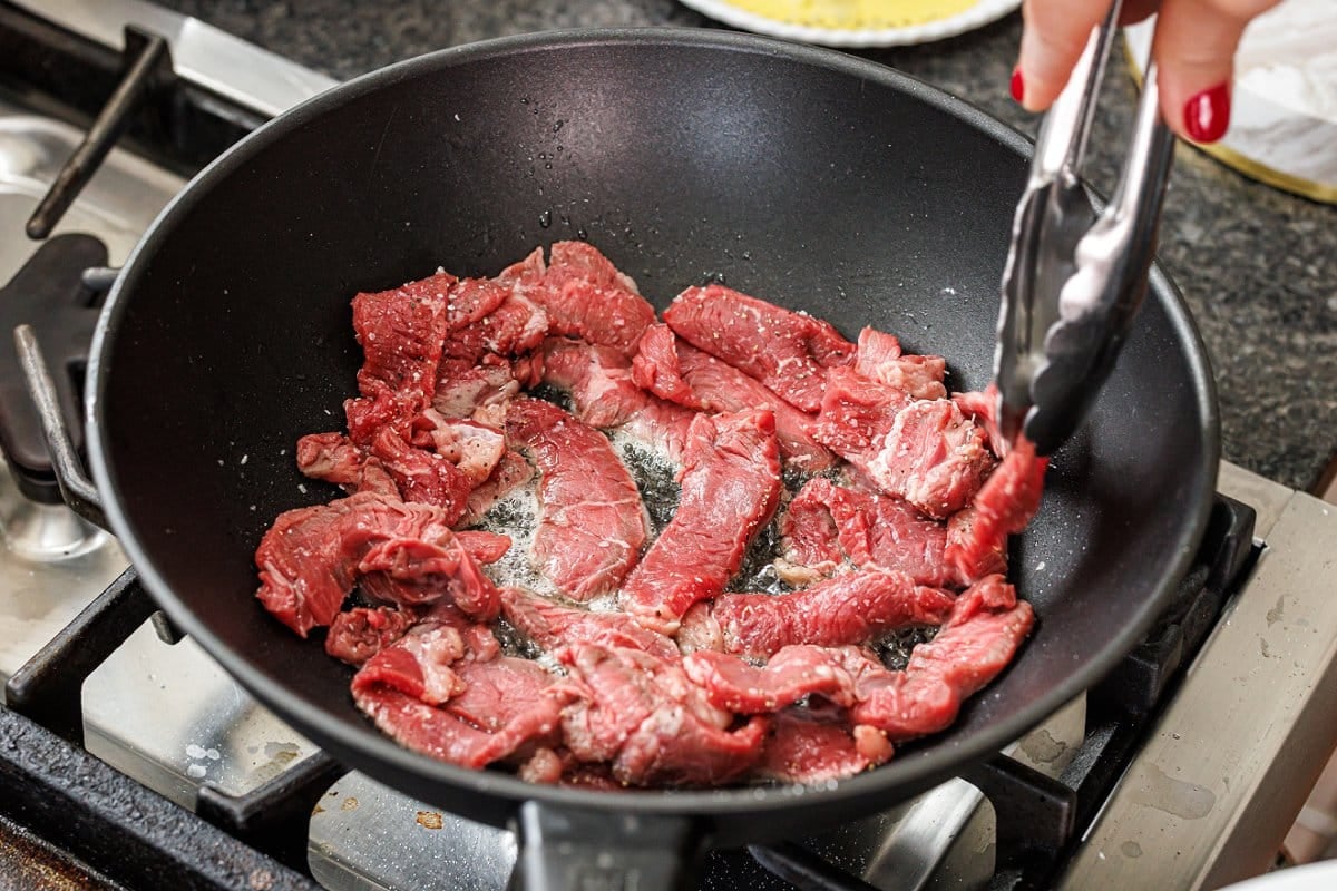 Cooking sirloin in a wok.