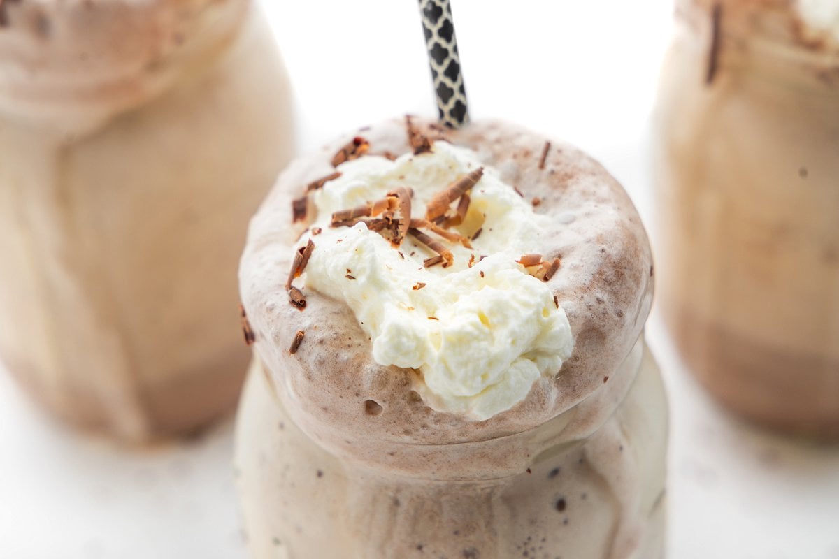 Frozen hot chocolate in a mason jar mug.